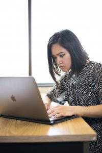 A student works on a laptop